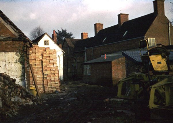 The yard at the back of the shop with outbuildings