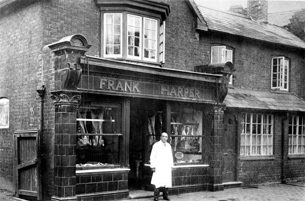 Frank Harper outside the shop in the 1940s