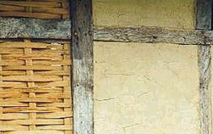 Wooden timbers coated with black tar